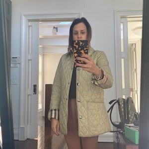 Tan light weight Burberry quilted nylon jacket discolored at collar